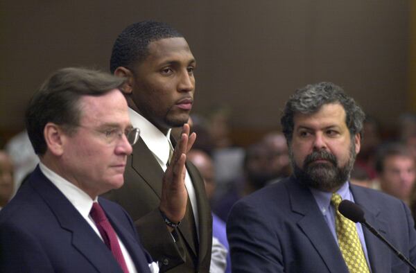 NFL star Ray Lewis (center) made a mid-trial guilty plea to a misdemeanor charge of obstruction of justice after striking a plea bargain with prosecutors. Attorneys Ed Garland (left) and Don Samuel (right) waged an aggressive legal and publicity campaign while getting their client off murder charges. STAFF PHOTO