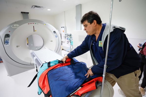 Vice President of Animal Health at Zoo Atlanta, Dr. Sam Rivera, shows the CT Scan machine during a tour in the Rollins Animal Center.
(Miguel Martinez / AJC)