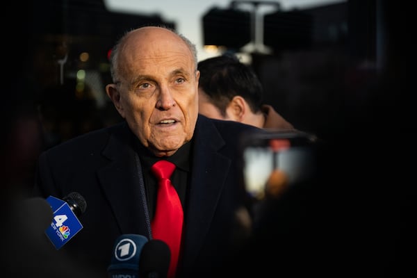 Rudy Giuliani speaks to members of the media at a campaign event on Jan. 21, 2024, in Manchester, New Hampshire. Giuliani is one 14 Trump allies still facing criminal charges in Fulton County. (Brandon Bell/Getty Images/TNS)