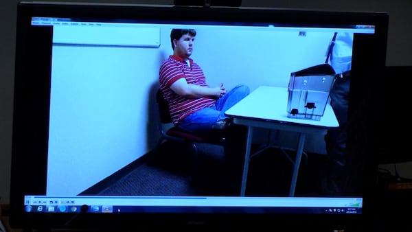 Jurors are shown another video from Justin Ross Harris' interrogation during Harris' murder trial at the Glynn County Courthouse in Brunswick, Ga., on Friday, Oct. 21, 2016. (screen capture via WSB-TV)