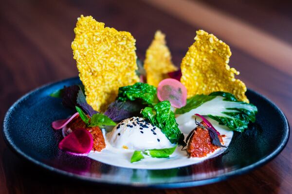 The Pan Asian Egg at the Alden is a soft coddled egg served with bok choy, ginger and sculptural rice crackers. CONTRIBUTED BY HENRI HOLLIS