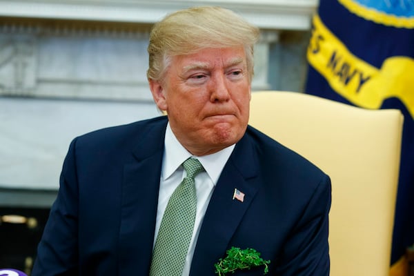 President Donald Trump listens to a question during a meeting with Irish Prime Minister Leo Varadkar in the Oval Office of the White House, Thursday, March 15, 2018, in Washington. (AP Photo/Evan Vucci)