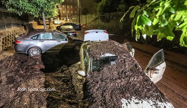 Cars were swept away amid rushing floodwater in Downtown Atlanta on Sept. 14, 2023.