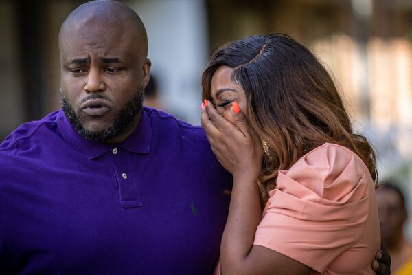 The mother and father of Nygil Cullins, Dr. Mya Speller Cullins (R), and Quinten Cullins become emotional while talking at a press conference in East Lake Friday. August 26, 2022. Steve Schaefer/steve.schaefer@ajc.com)