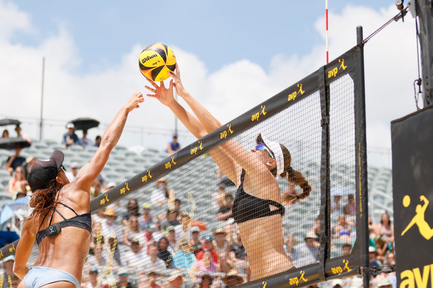  Terese Cannon blocks Julia Scoles' spike during the AVP Gold Series Atlanta Open beach volleyball women's championship match Sunday at Atlantic Station. (Miguel Martinez / miguel.martinezjimenez@ajc.com)