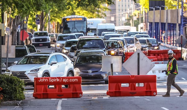 Authorities have shut down West Peachtree Street near 3rd Street. 