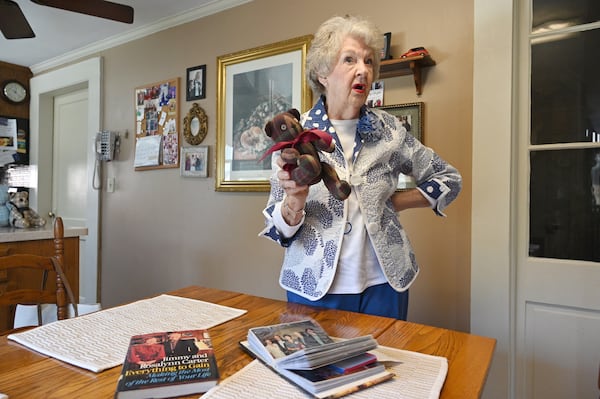 Nelle Ariail, who is a long-time friend of the Carters and has traveled around the world with them, holds a teddy bear she made with a shirt worn by Jimmy Carter, at her home, Monday, Feb. 20, 2023, in Plains, GA. (Hyosub Shin / Hyosub.Shin@ajc.com)