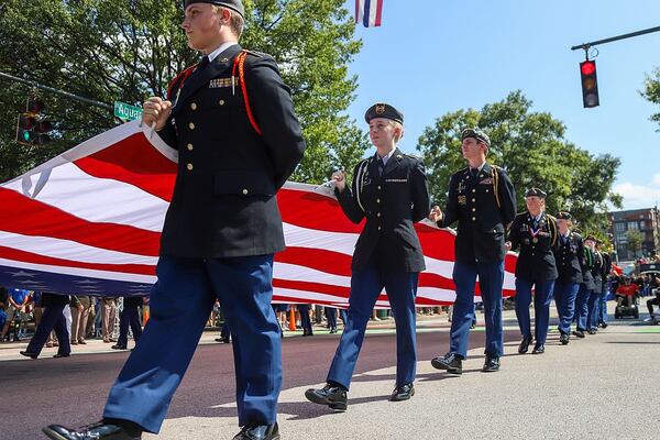 Signal Mountain High School carries an American flag in the parade. The Coolidge National Medal of Honor Heritage Center, city of Chattanooga, Hamilton County and Chattanooga Area Veterans Council held a “Welcome Home” parade for new Medal of Honor recipient Larry Taylor of Signal Mountain. (Photo Courtesy of Olivia Ross)