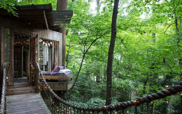 This Intown Atlanta treehouse has three separate rooms, each connected by rope bridges.