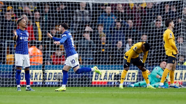 Ipswich Town's Conor Chaplin, second left, celebrates his side's first goal after Wolverhampton Wanderers' Matt Doherty scores an own goal, during the English Premier League soccer match between Wolverhampton Wanderers and Ipswich Town, at Molineux Stadium, in Wolverhampton, Saturday, Dec. 14, 2024. (Nigel French/PA via AP)