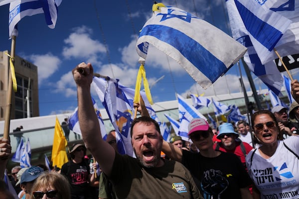 Israelis march in a protest against Prime Minister Benjamin Netanyahu and his plans to dismiss the head of the Shin Bet internal security service, on Wednesday, March 19, 2025. (AP Photo/Ohad Zwigenberg)