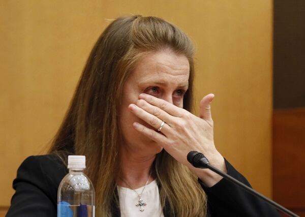 Tex and Diane McIver’s masseuse, Annie Anderson, reacts as she talks about the day Diane McIver was shot as she testifies during the Tex McIver murder trial at the Fulton County Courthouse on Thursday, April 12, 2018. (Bob Andres bandres@ajc.com)