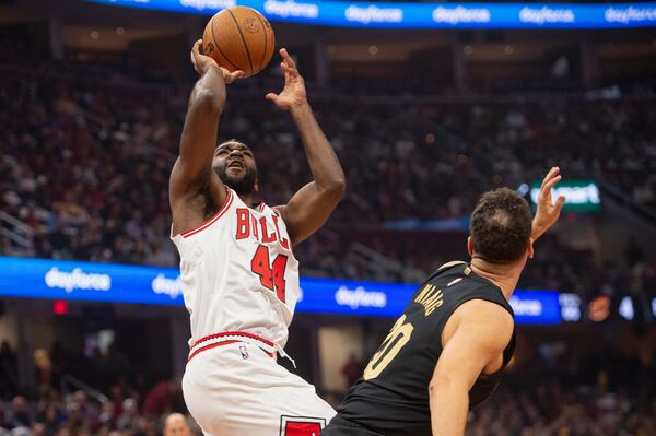 Chicago Bulls' Patrick Williams (44) shoots over Cleveland Cavaliers' Georges Niang, right, during the first half of an Emirates NBA basketball game in Cleveland, Friday, Nov 15, 2024. (AP Photo/Phil Long)