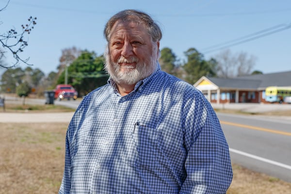 Jimmy Shackelford revisits the site of a 2017 crash in Milledgeville where a driver fleeing a Georgia State Patrol trooper hit his pickup head-on. The crash left Shackelford with severe injuries. Shackelford says that better judgment by the patrol officer might have prevented the crash. (Natrice Miller/ Natrice.miller@ajc.com)