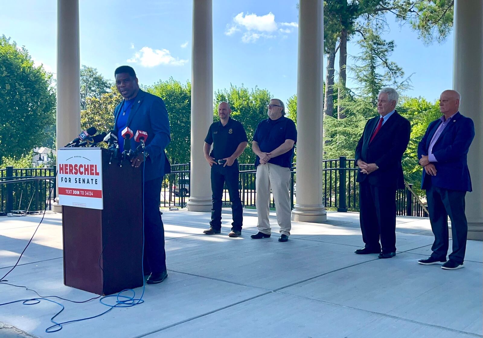 Republican hopeful Herschel Walker campaigns with former U.S. House Speaker Newt Gingrich in Alpharetta. 