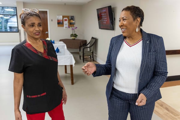 A.G. Rhodes Atlanta Administrator Loretta Barnes (right) chats with Abeba Damena, a caregiver at the Cobb County nursing home.
PHIL SKINNER FOR THE ATLANTA JOURNAL-CONSTITUTION