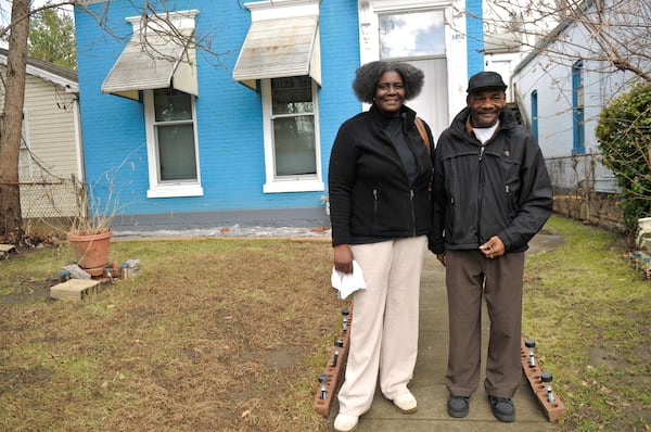 Eunice Johnson with her husband, Andrew, outside their home in Louisville. (Nina N. Greipel / For the AJC)