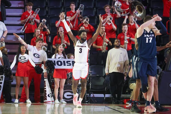 Georgia guard Noah Thomasson (3) celebrates as time expires reacting to their 78-76 win against Xavier in the first round of the NCAA’s NIT at Stegeman Coliseum, Tuesday, March 19, 2024, in Athens, Ga. (Jason Getz / jason.getz@ajc.com)