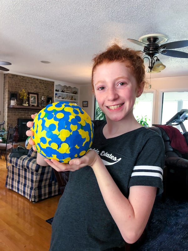 APRIL 1, 2019: When Sofie Moricle saw the reigning world-record sticker ball in 2018, she pointed to the image and declared to her parents: “We can break this record.” Initially, her father, Wade Moricle, laughed. (Courtesy of Wade Moricle)