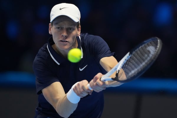 Italy's Jannik Sinner returns to Taylor Fritz of the United States during the final match of the ATP World Tour Finals at the Inalpi Arena, in Turin, Italy, Sunday, Nov. 17, 2024. (AP Photo/Antonio Calanni)