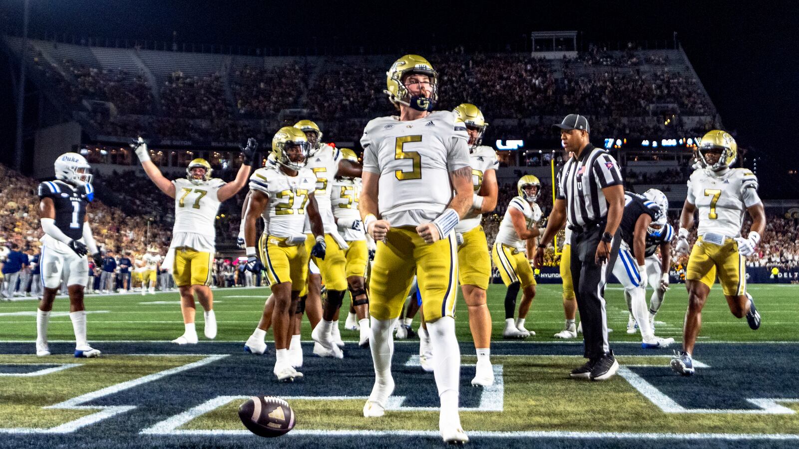 Georgia Tech Yellow Jackets quarterback Zach Pyron (5) celebrates in the end zone after a rushing touchdown in the first quarter of a football game against the Duke BlueDevils, Saturday, Oct. 5, 2024, in Atlanta. (AP Photo/Jason Allen)