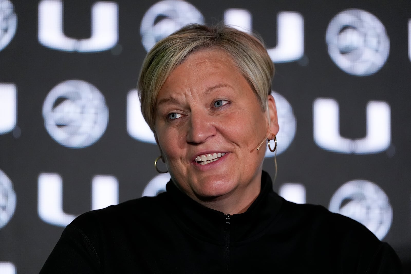 Miami head coach Tricia Cullop speaks during the ACC women's NCAA college basketball media day, Tuesday, Oct. 8, 2024, in Charlotte, N.C. (AP Photo/Chris Carlson)