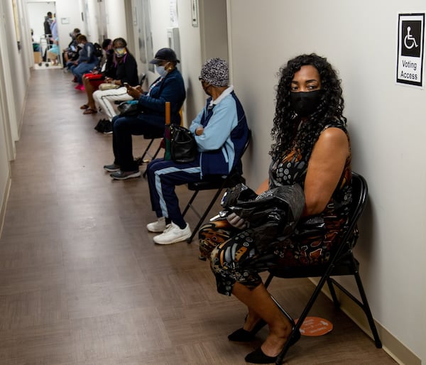 Xavier Benjamin (R) waits to vote at the South Fulton Service Center early on Friday morning, May 22, 2020. Benjamin said she arrived at the center at 6:20 am to secure her first place in line. STEVE SCHAEFER FOR THE ATLANTA JOURNAL-CONSTITUTION