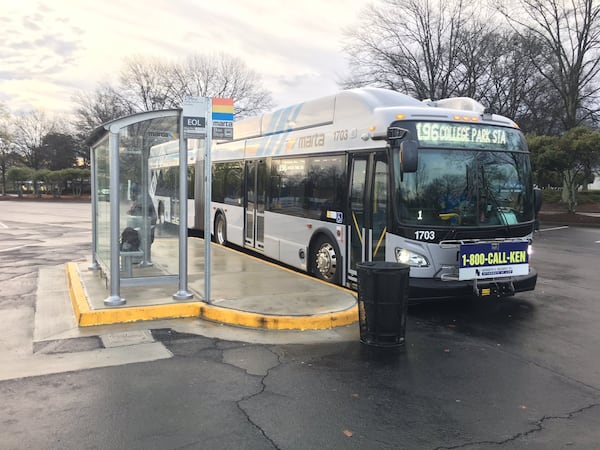 A MARTA bus waits for passengers at its Southlake Mall stop in Clayton County. Photo credit: BRANDON FRANKLIN