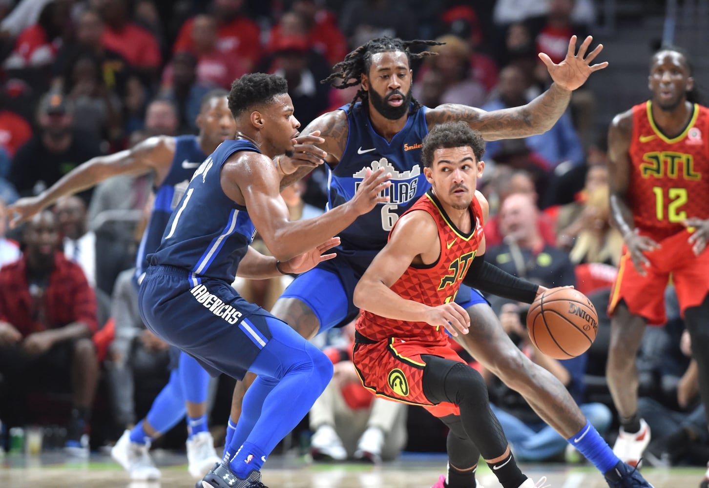 Photos: Hawks rally to beat Mavs in home opener