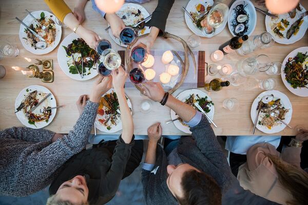 View from above friends toasting wine glasses