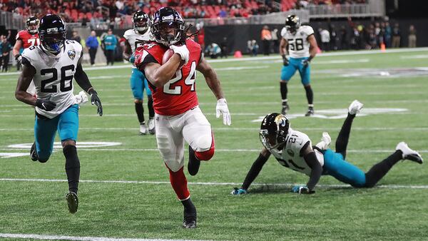 Atlanta Falcons running back Devonta Freeman breaks free for a touchdown run on the opening drive against the Jacksonville Jaguars Sunday, Dec. 22, 2019, at Mercedes-Benz Stadium in Atlanta.