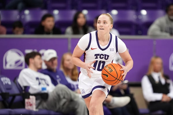 FILE - TCU guard Hailey Van Lith parepares to make a pass during an NCAA college basketball game against Louisiana Tech in Fort Worth, Texas, Sunday, Dec. 15, 2024. (AP Photo/Tony Gutierrez, File)