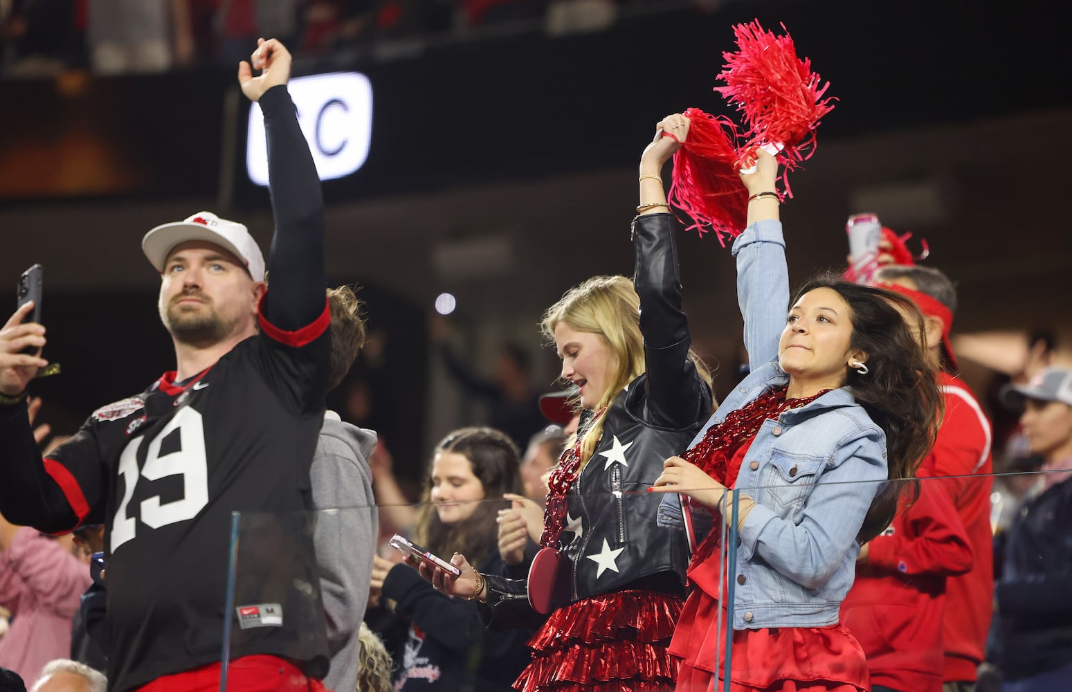 Georgia Bulldogs fans react after a scored against the TCU Horned Frogs during the second half of the College Football Playoff National Championship at SoFi Stadium in Los Angeles on Monday, January 9, 2023. Georgia won 65-7 and secured a back-to-back championship. (Jason Getz / Jason.Getz@ajc.com)