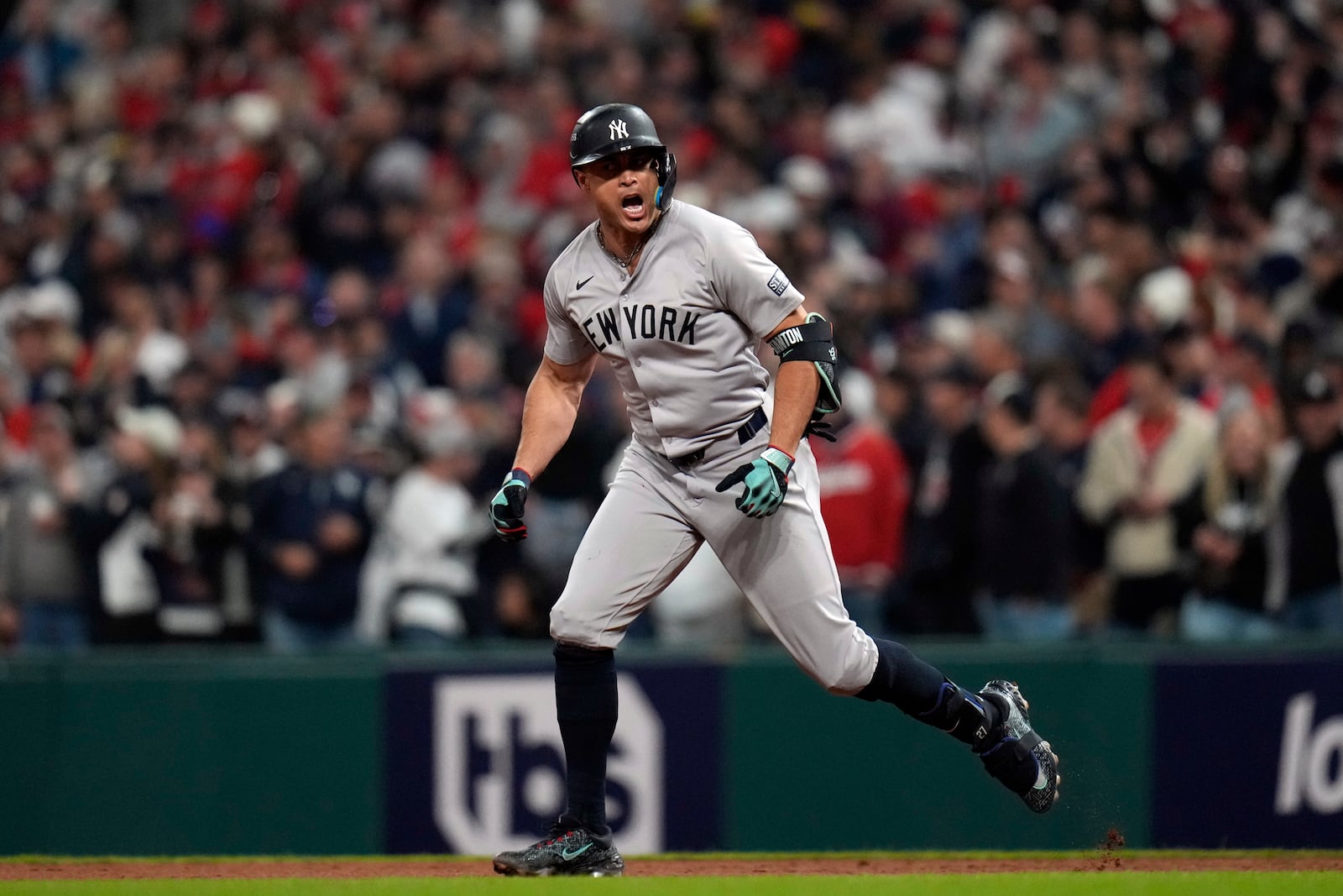 New York Yankees' Giancarlo Stanton celebrates after hitting a home run against the Cleveland Guardians during the eighth inning in Game 3 of the baseball AL Championship Series Thursday, Oct. 17, 2024, in Cleveland.(AP Photo/Jeff Roberson)