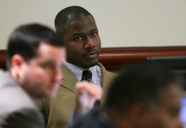 080929-ATLANTA- Accused gunman Brian Nichols listens to testimony from retired Fulton County Deputy Grantley White as he takes the stand for the second day during proceedings Monday 9/29/09. Nichols is accused of murdering Judge Rowland Barnes and court reporter Julie Ann Brandau at the Fulton County Courthouse before escaping the facility and gunning down Deputy Sheriff Hoyt Teasley and David Wilhelm, an off-duty federal agent, in 2005. John Spink / Atlanta Journal Constitution - Pool Brian Nichols during his 2005 murder trial. AJC file photo: John Spink