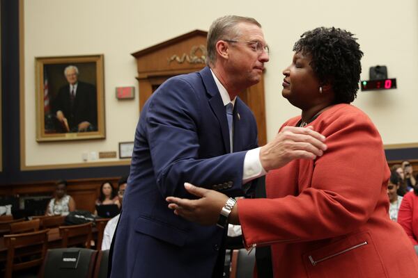 Then-U.S. Rep. Doug Collins (R-GA) greets former Democratic leader in the Georgia House of Representatives and founder and chair of Fair Fight Action Stacey Abrams prior to a hearing before the Constitution, Civil Rights and Civil Liberties Subcommittee of House Judiciary Committee June 25, 2019 on Capitol Hill in Washington.  (Photo by Alex Wong)