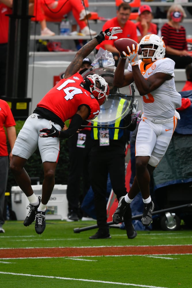 Tennessee wide receiver Josh Palmer makes a catch as Georgia defensive back DJ Daniel (14) defends during the second half of a football game Saturday, Oct. 10, 2020, at Sanford Stadium in Athens. Georgia won 44-21. JOHN AMIS FOR THE ATLANTA JOURNAL- CONSTITUTION