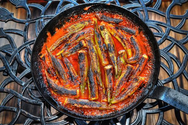 Shay Lavi's Roasted Okra. At Nur Kitchen on Buford Highway, chef Shay Lavi loves to saute veggies like this okra in tomato sauce on top of the stove, then place the skillet in the restaurant's super-hot oven. This okra dish pairs well with his Pilaf of Bulgur and Peas. (Styling by chef Shay Lavi / Chris Hunt for the AJC)