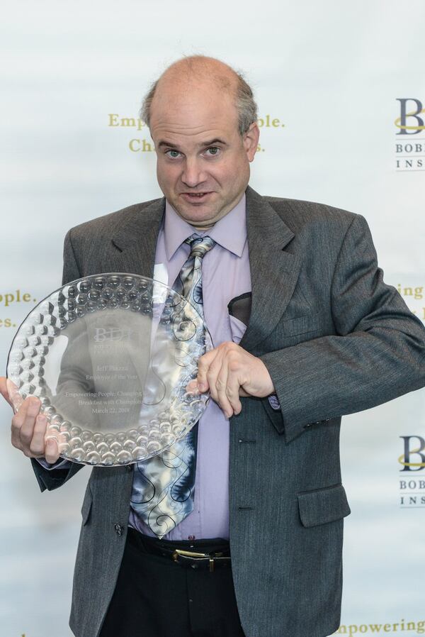 Jeff Piazza was named Employee of the Year at the Bobby Dodd Institute’s Breakfast With Champions recently at the Cobb Galleria. Piazza works as a janitor at Fort Gillem Enclave, where BDI manages the cleaning and maintenance of 22 buildings. CONTRIBUTED BY KAT GODUCO PHOTOGRAPHY