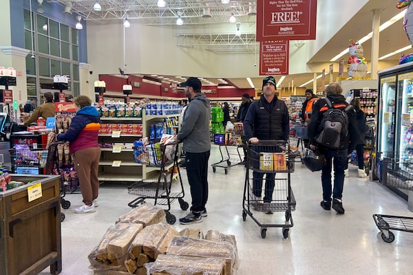 Customers wait in line to buy their groceries as others navigate the crowds at the Ingles Grocery store on Jan. 9 in Peachtree Corners, Ga. Gov. Consumers could see rising grocery prices if President-elect Donald Trump's plans for tariffs for goods imported from Mexico, China and Canada are put in place. (Jason Getz/AJC)
