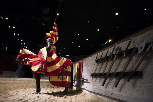 A knight sits on his horse as they practice during a media tour of Medieval Times Dinner & Tournament hours before the new show’s opening night at Sugarloaf Mills . (Casey Sykes for The Atlanta Journal-Constitution)