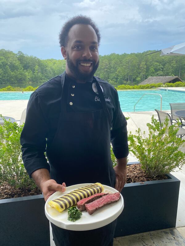 Pheasant Blue Executive Chef Steven Brooks shows his steak and egg breakfast dish, featuring a striped omelet made with pureed mushrooms. Ligaya Figueras/ligaya.figueras@ajc.com