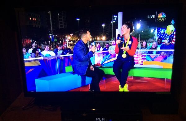 Ryan Seacrest interviews gold medal-winning swimmer Maya Dirado on his late-night  NBC show from Rio during last summer's Olympic Games. During this interview, Seacrest told DiRado, who was about to move to Atlanta, to call his mother in Dunwoody. (NBC screen grab)