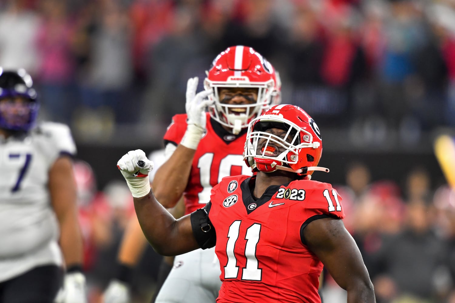 Georgia Bulldogs linebacker Jalon Walker (11) reacts after sacking TCU Horned Frogs quarterback Max Duggan as linebacker Jamon Dumas-Johnson (10) looks on during the second half of the College Football Playoff National Championship at SoFi Stadium in Los Angeles on Monday, January 9, 2023. Georgia won 65-7 and secured a back-to-back championship. (Hyosub Shin / Hyosub.Shin@ajc.com)