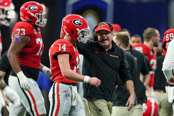 Georgia quarterback Gunner Stockton talks with head coach Kirby Smart during the SEC Championship Game.