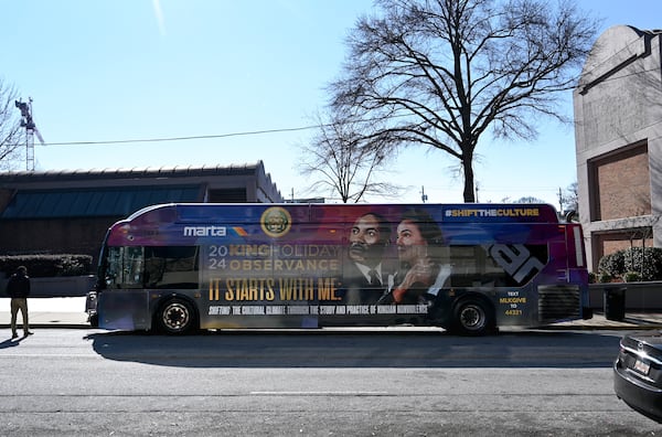 A Marta bus wrapped with 2024 King Holiday Observance theme is seen outside The King Center, Thursday, December 4, 2024, in Atlanta. (Hyosub Shin / Hyosub.Shin@ajc.com)