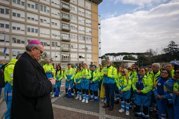 Bishop Franco Agostinelli leads a rosary prayer for Pope Francis in front of the Agostino Gemelli Polyclinic, in Rome, Saturday, March 8, 2025, where the Pontiff is hospitalized since Friday, Feb. 14. (AP Photo/Andrew Medichini)