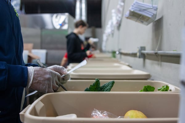 Fresh Harvest produce is packed in reusable plastic bins. At the end of the packing line, a checker makes sure everything the customer ordered is in the box. CONTRIBUTED BY FRESH HARVEST