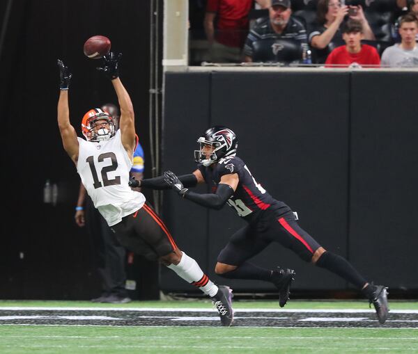 Falcons cornerback Isaiah Oliver breaks up a pass to Cleveland Browns wide receiver KhaDarel Hodge during the first quarter of the final exhibition game of the preseason Sunday, Aug. 29, 2021, at Mercedes-Benz Stadium in Atlanta. (Curtis Compton / Curtis.Compton@ajc.com)