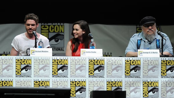 Actors Richard Madden, Emilia Clarke, and writer George R.R. Martin speak onstage during the 'Game Of Thrones' panel during Comic-Con International 2013 at San Diego Convention Center on July 19, 2013 in San Diego, California.